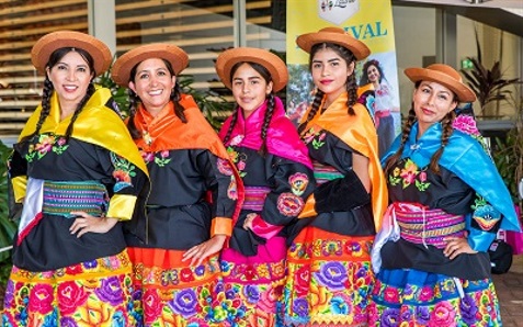 Women dressed in traditional clothes at the Etnia Latina Festival